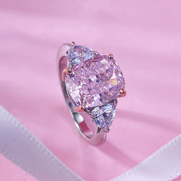 Fancy Pink Three Stone Engagement Ring Crafted in Sterling Silver