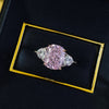 Fancy Pink Three Stone Engagement Ring Crafted in Sterling Silver