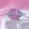 Fancy Pink Three Stone Engagement Ring Crafted in Sterling Silver