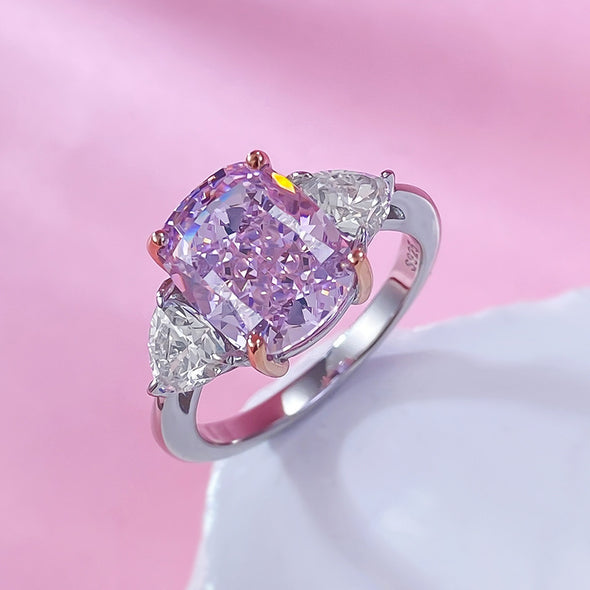 Fancy Pink Three Stone Engagement Ring Crafted in Sterling Silver