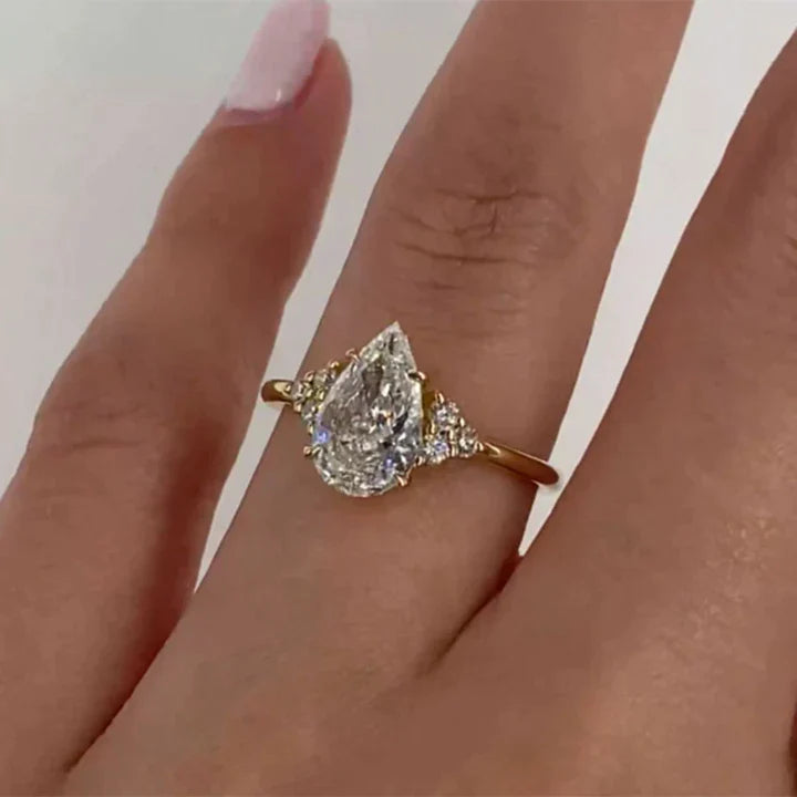 Pear Cut Solitaire Ring with Side Stone