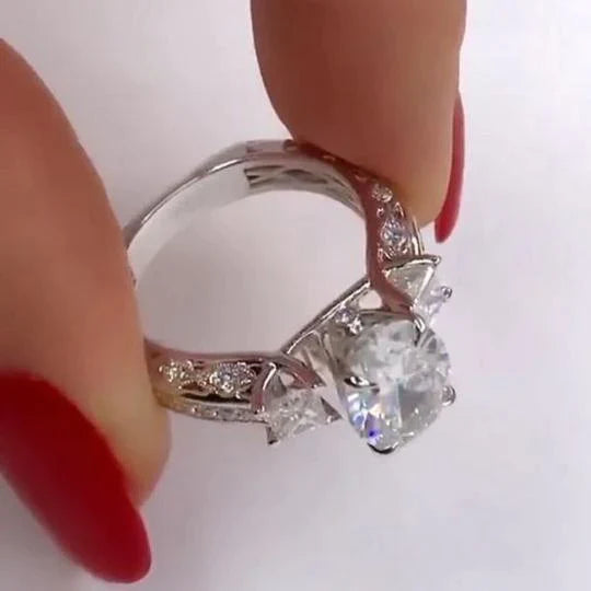 Oval Cut Engagement Ring with Two Princess Sidestones