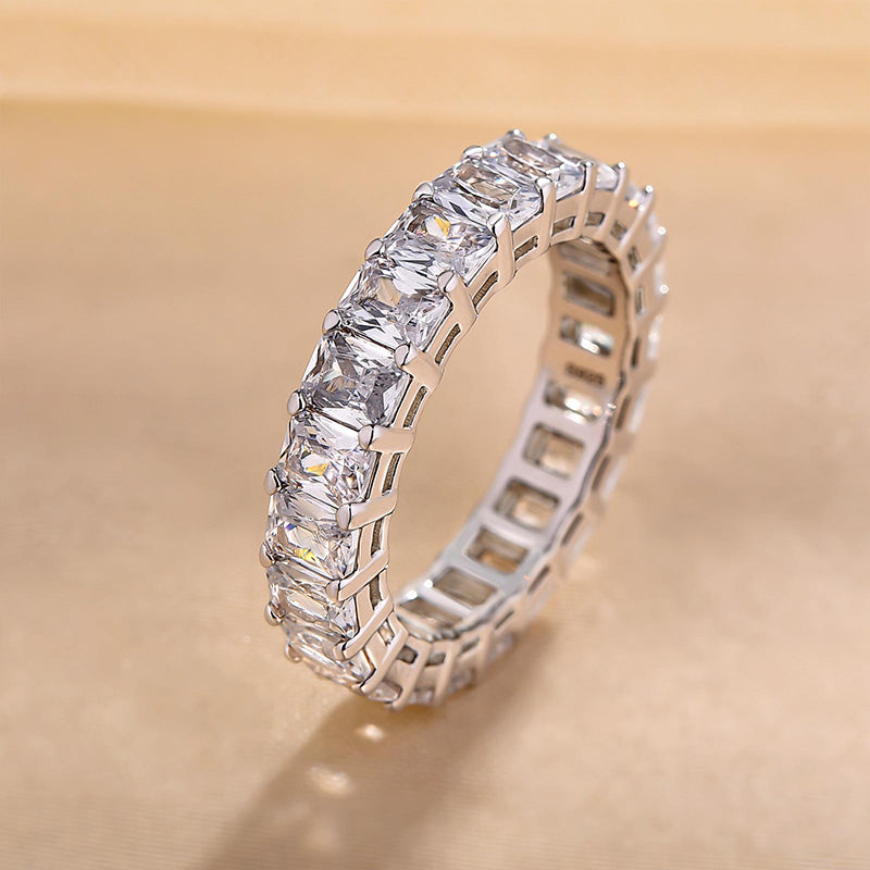 Elegant Radiant Cut Eternity Band In Sterling Silver