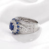 Sunflower Halo Round Cut Blue Sapphire Engagement Ring in Sterling Silver