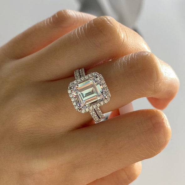 Halo Emerald Cut Sterling Silver Bridal Set with Side Stone Band